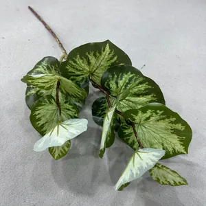Realistic variegated artificial green leaves detail for home decor and floral arrangements.