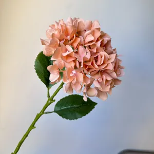 Detailed view of peach pink artificial hydrangea flower stem for wedding home decoration