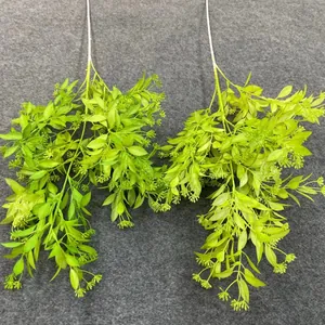 Detailed view of two artificial green foliage stems for wedding floral arrangements