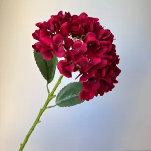 Premium close-up detail of a deep red artificial hydrangea stem for wedding decor.