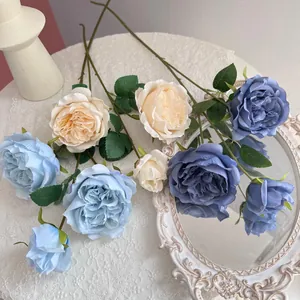 Detailed view of silk Austin roses in soft blue and cream shades for elegant home decoration