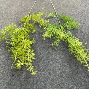Macro detail of realistic artificial green foliage for forest-style wedding decor