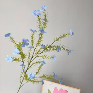 Detailed view of artificial blue periwinkle wild flowers for pastoral wedding decor
