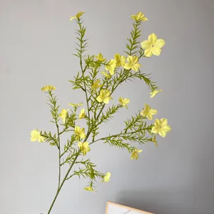Detailed view of artificial yellow periwinkle stem with green needle-like leaves