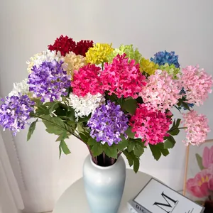 Detailed view of colorful 3-head artificial hydrangea bundle in a ceramic vase for home decor