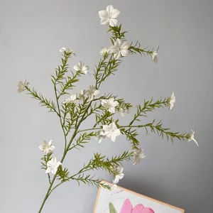 A detailed close-up showing the delicate white petals of artificial periwinkle stems
