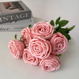 Close-up of 7-head pink artificial rose bouquet for elegant wedding table decoration