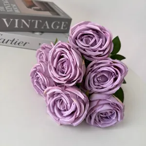 Close-up view of 7-head purple silk roses bouquet for elegant wedding and home decoration.