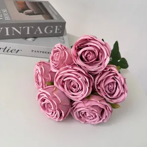 Detailed macro shot of a bouquet of 7 dusty pink artificial empress roses for decor