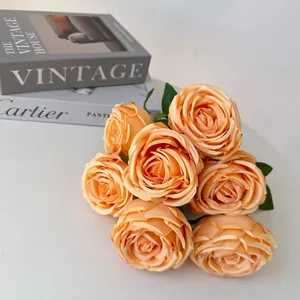 Detailed view of a 7-head artificial orange rose bouquet for elegant wedding home decor.