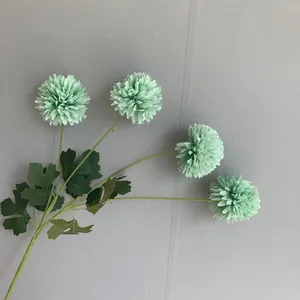 Detailed view of 4-head mint green artificial chrysanthemum for wedding floral decor.