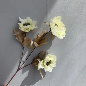 Detail showing 3-head creamy white artificial peonies with realistic dark centers