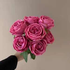 Close-up of 7-head artificial pink rose bouquet for wedding and home decoration