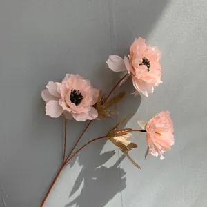 Detailed view of artificial three-headed peony flower with realistic petals for home decor
