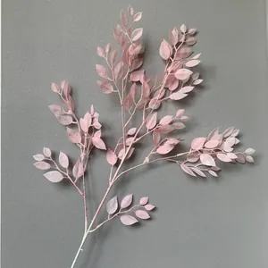 Close-up of elegant pink artificial banyan leaves for wedding and event decoration