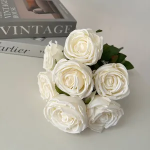 Close-up of 7-head white artificial rose bouquet for wedding decor and home table display