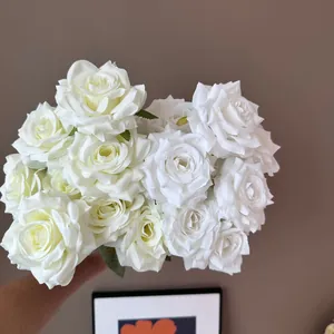 Handheld bouquet of nine lifelike white silk roses for wedding and hotel floral decor