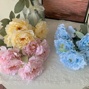 Detailed view of cream, pink, and blue 5-head artificial peony bouquets for home decoration.