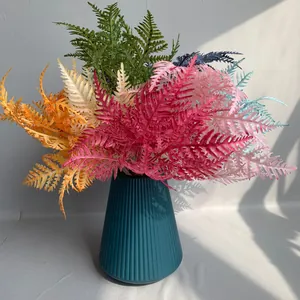 Vibrant artificial fern leaves in various colors for elegant home or wedding decor