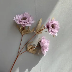 Detailed macro view of a 3-headed artificial purple peony flower for wedding decor