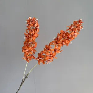Macro view of vibrant orange artificial hyacinth flower branch with detailed white stamens