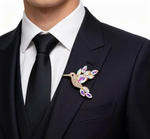 Detail view of colorful hummingbird brooch with crystals pinned on a dark suit lapel