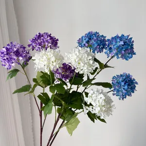 Close-up of three-head viburnum hydrangea artificial flowers in purple, white, and blue.