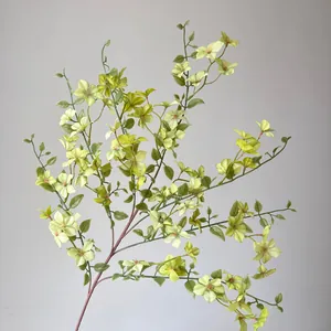 Vue détaillée d'une branche de Mock Orange artificielle vert-jaune pour décoration florale