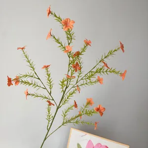 Detailed view of long branch orange artificial periwinkle wildflower for home decoration