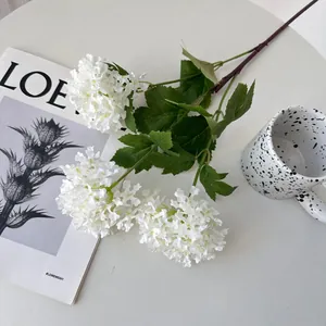Close-up detail of white 3-head artificial hydrangea snowball flowers for home decor