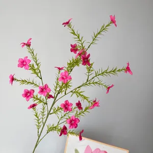 Detailed macro view of artificial pink periwinkle flowers with realistic green stems