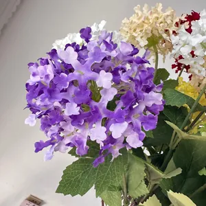 Detailed macro shot of realistic purple snowflake hydrangea petals with green leaves