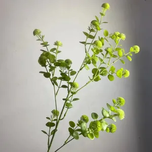 Detailed close-up view of artificial green leaf branches for forest style wedding decor