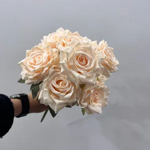 Detailed view of the realistic petal texture on a 9-head cream artificial rose bouquet