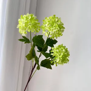 Detailed shot of a 3-head artificial green mock orange hydrangea flower for home decor