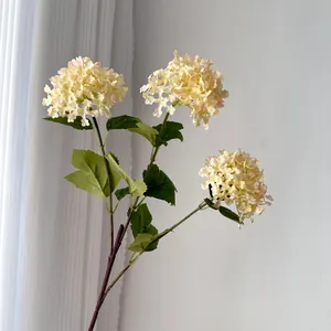 Detail view of 3-head artificial cream hydrangea flowers for home wedding decoration