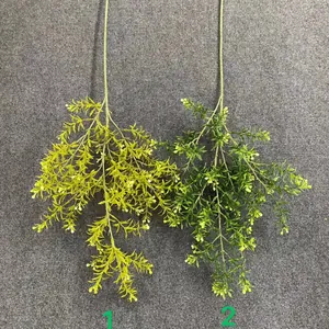 Close-up detail of two realistic artificial green leaf stems for wedding party decor