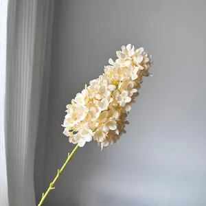 Detailed macro shot of an elegant artificial cream white pagoda hydrangea stem