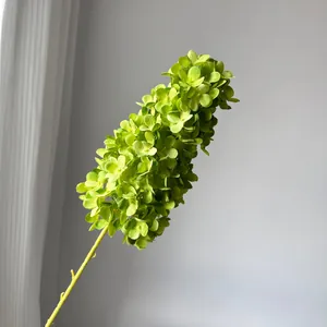 Macro detail of a realistic lime green tower hydrangea artificial flower for wedding decor