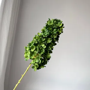 Close-up detail of a realistic artificial green pagoda hydrangea stem for wedding decor