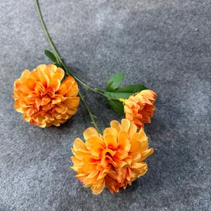 Detailed view of vibrant orange 3-head silk artificial flower for wedding and home decoration