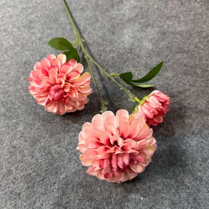 Detailed view of three-headed artificial pink dahlia silk flower stem for wedding decor