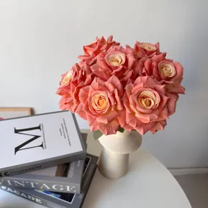 Detailed view of 7-head silk peach roses in a white ceramic vase for elegant home decor