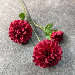 Detailed macro view of three elegant dark red silk artificial dahlia flowers for wedding