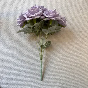 Detailed view of a 7-head bouquet of purple artificial silk roses for home decor.