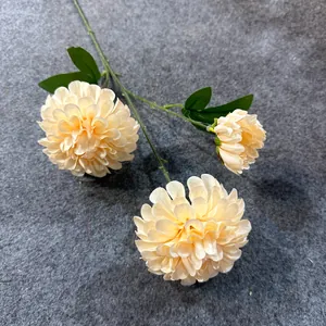 Detail of 3-head cream silk artificial flowers with textured petals and green leaves