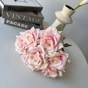 Detailed view of realistic 7-head pink silk roses with layered petals for home decor