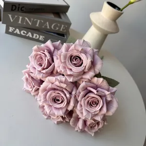 Detailed close-up of seven-headed mauve artificial silk roses for home wedding decor.