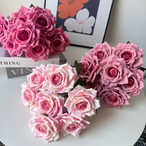 Close-up of three multi-colored 7-head artificial rose bouquets for home decor.