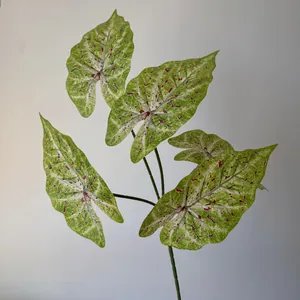 Detailed view of a 3D printed artificial Caladium leaf with pink speckled patterns